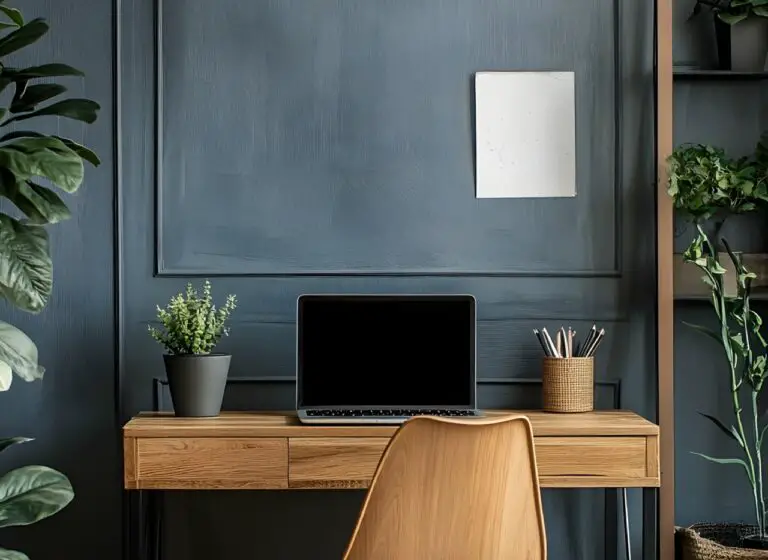 Minimal home office with dark walls and wooden desk